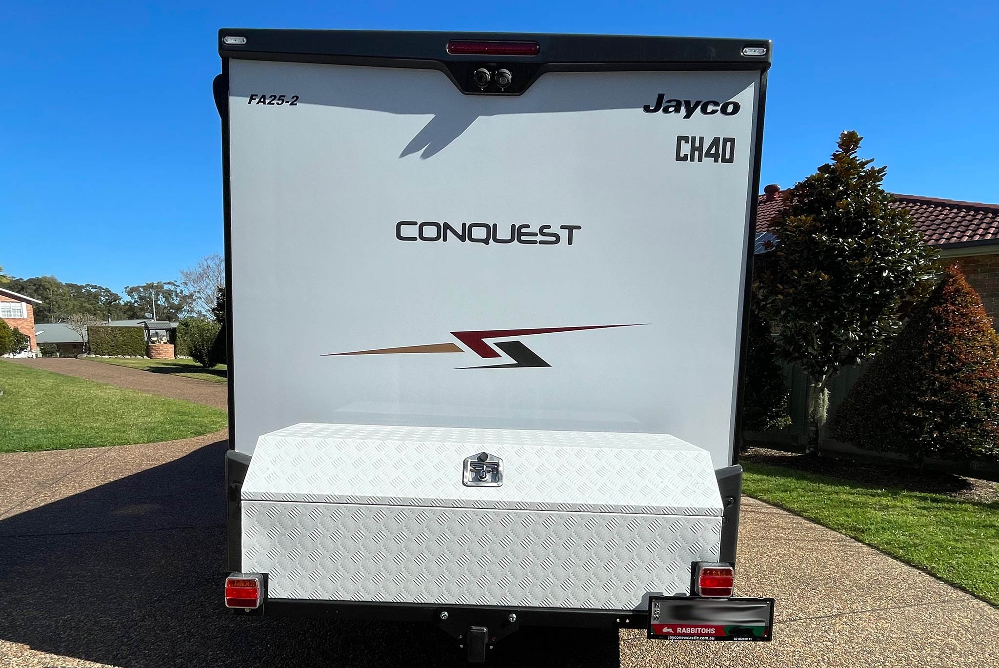 Rack N Roll Motorhome towbar receiver mounted storage box base securely holding a white checkerplate toolbox